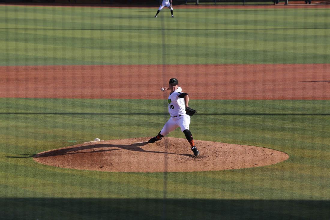 The crowd is silent with anticipation as the pitcher winds up the ball for a throw. (Ali Watson/Emerald)