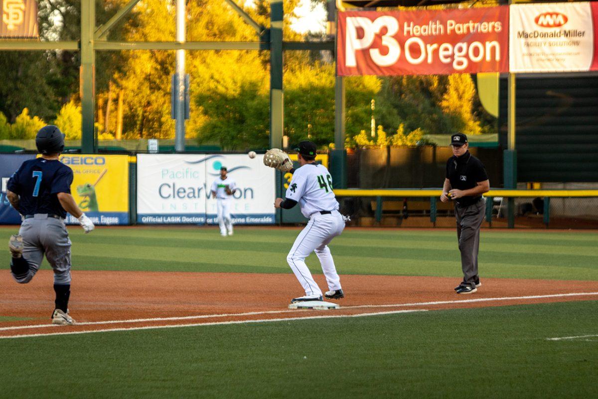 Tyler Flores (46) catches a ball and tags out the AquaSox runner, Kaden Polcovich (7). The Eugene Emeralds suffered a major 10-2 defeat at the hands of the Everett AquaSox on Wednesday, July 7 at PK Park in Eugene, Oregon. (Will Geschke/Emerald)