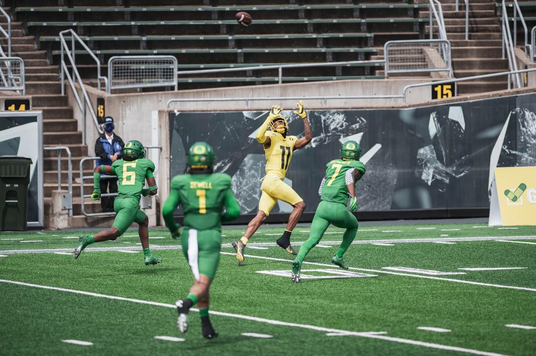 Ducks wide receiver Troy Franklin (11) lunges for the ball moments before halftime. Oregon Ducks Football host annual Spring game at Autzen Stadium in Eugene, Ore., on May 1, 2021. (Maddie Stellingwerf)