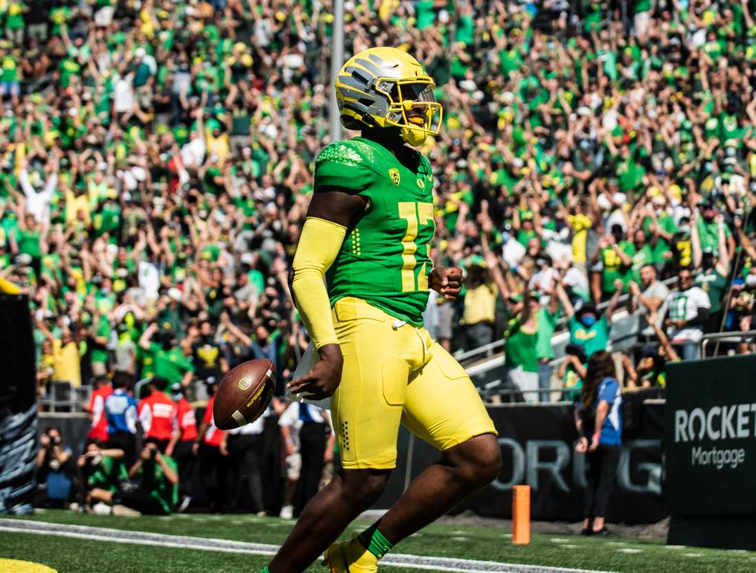 Ducks quarterback Anthony Brown (13) drops the ball after running it to the endzone and scoring a touchdown, putting the ducks ahead of the Bulldogs at 31-24. The Oregon Ducks host Fresno State on September 4th, 2021, for game one of the 2021 season.