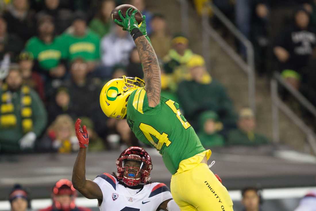 Oregon Ducks tight end Cam McCormick (84) reaches up to make a catch over Arizona Wildcats safety Demetrius Flannigan-Fowles (6) The Oregon Ducks host the Arizona Wildcats at Autzen Stadium in Eugene, Ore. on Saturday, Nov. 18, 2017. (Adam Eberhardt/Emerald)