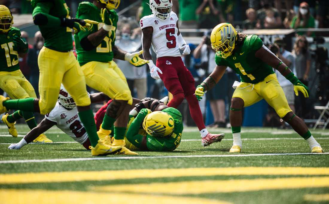 Ducks outside linebacker Mase Funa (47) cradles the ball after falling to the ground. The Oregon Ducks host Fresno State on September 4th, 2021, for game one of the 2021 season.