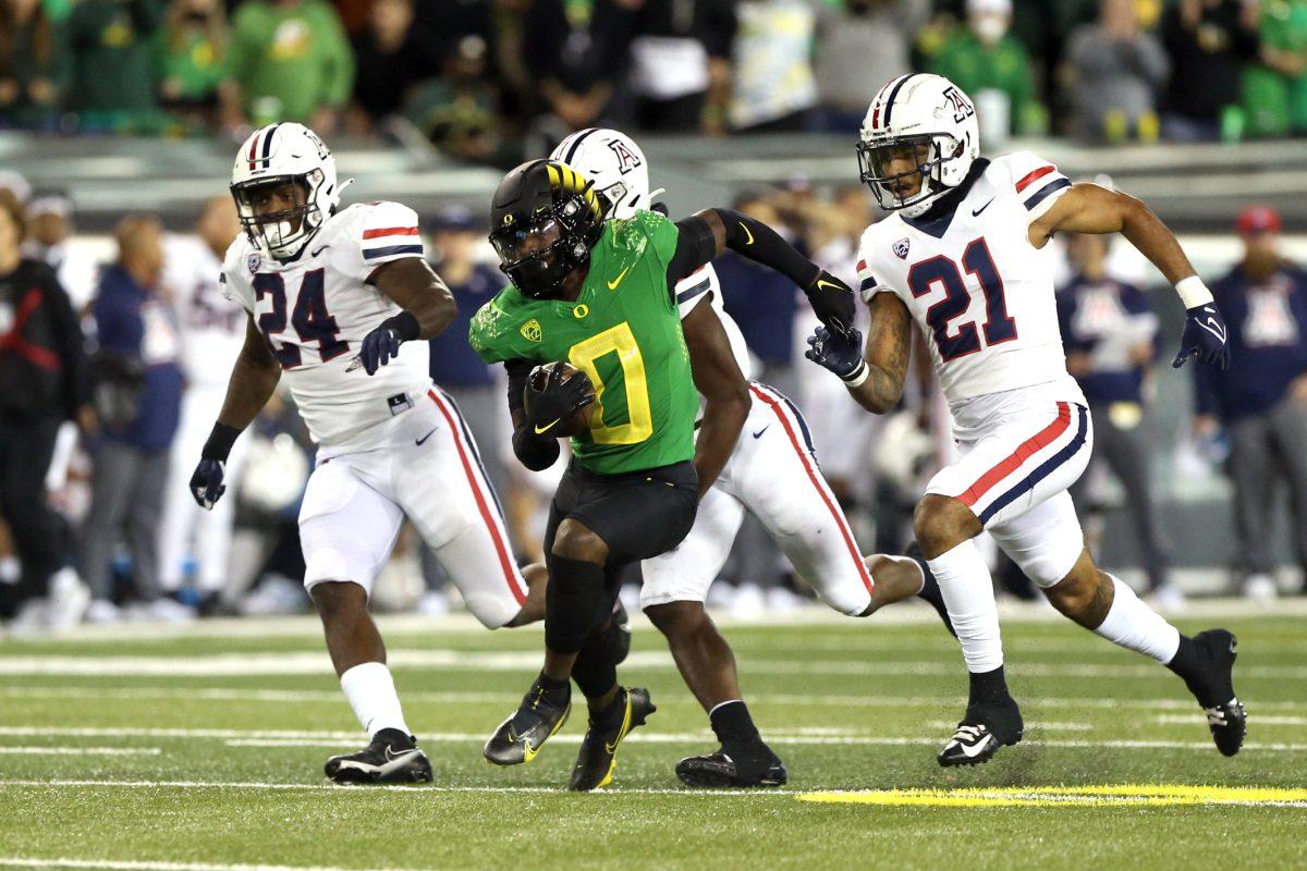 Running back Seven McGee (#0) runs for a big gain as the No. 3 Oregon Ducks face the Arizona Wildcats in a college football game at Autzen Stadium in Eugene, Oregon on Saturday, Sept. 25, 2021. Sean Meagher/The Oregonian