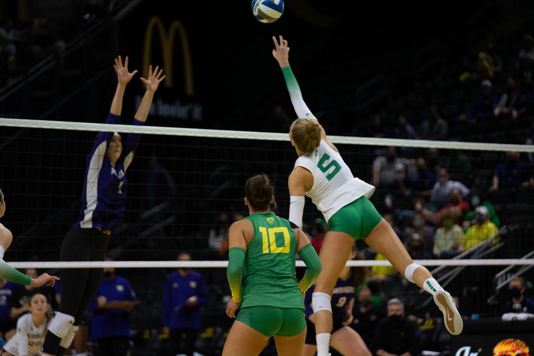 Brooke Nuneviller (5) leaps for an attempt to tip the ball over the net. The Oregon Ducks face the Washington Huskies on October 14th, 2021, at Matthew Knight Arena. (Serei Hendrie/Emerald)