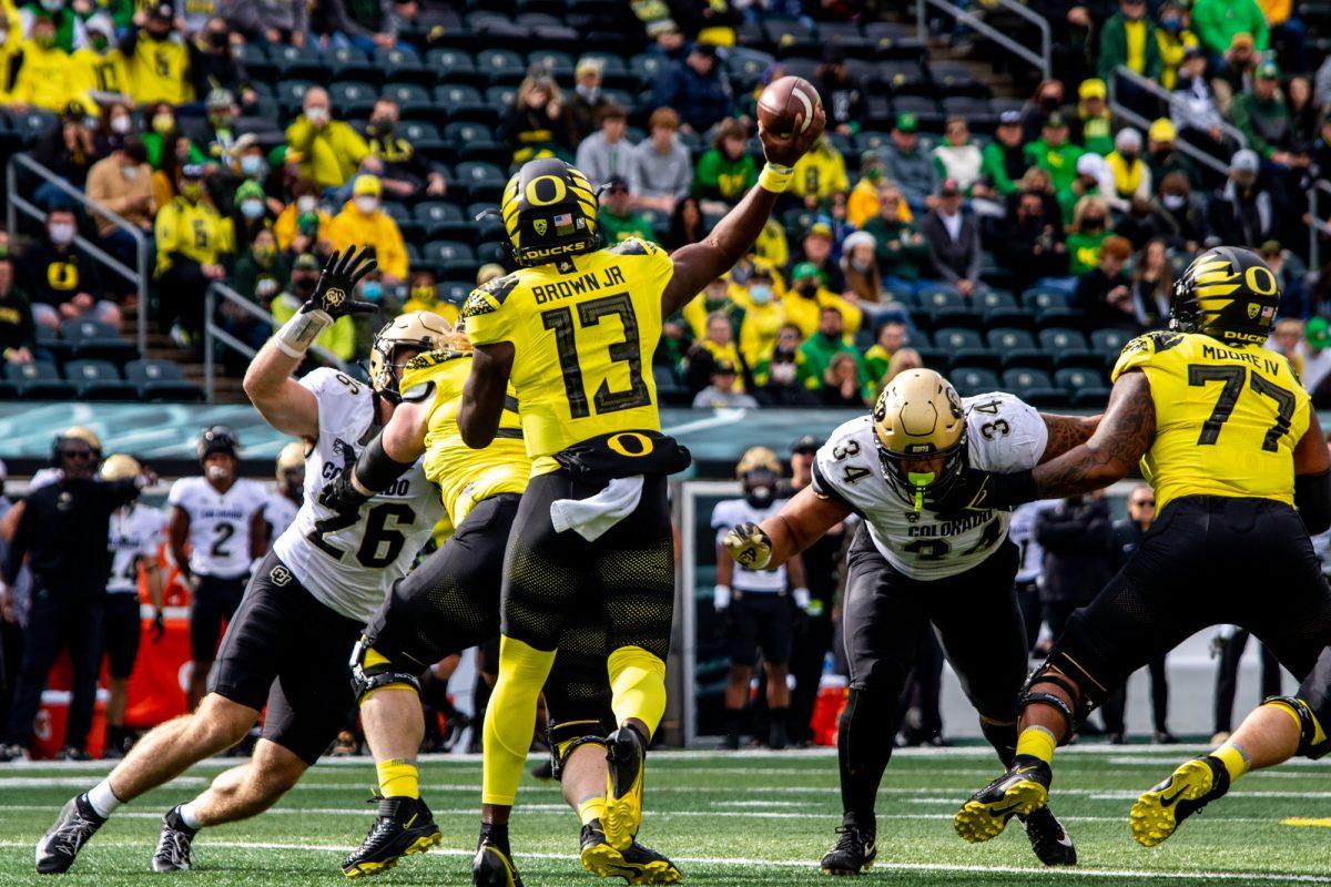 Anthony Brown (13) throws a pass to a teammate. The University of Oregon Ducks defeated the University of Colorado Buffaloes 52-29 at Autzen Stadium on October 30, 2021. (Will Geschke/Emerald)