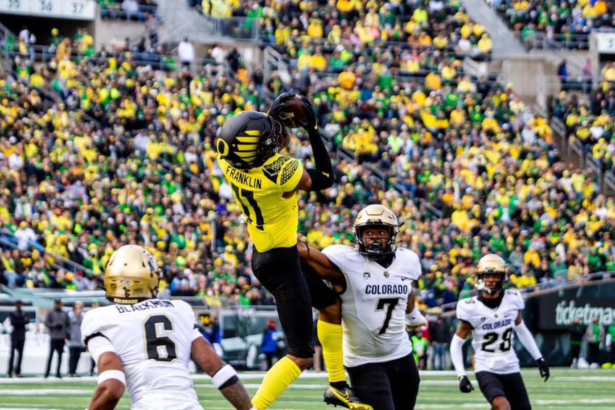 Troy Franklin (11) catches a ball to score a touchdown for Oregon. The University of Oregon Ducks defeated the University of Colorado Buffaloes 52-29 at Autzen Stadium on October 30, 2021. (Will Geschke/Emerald)