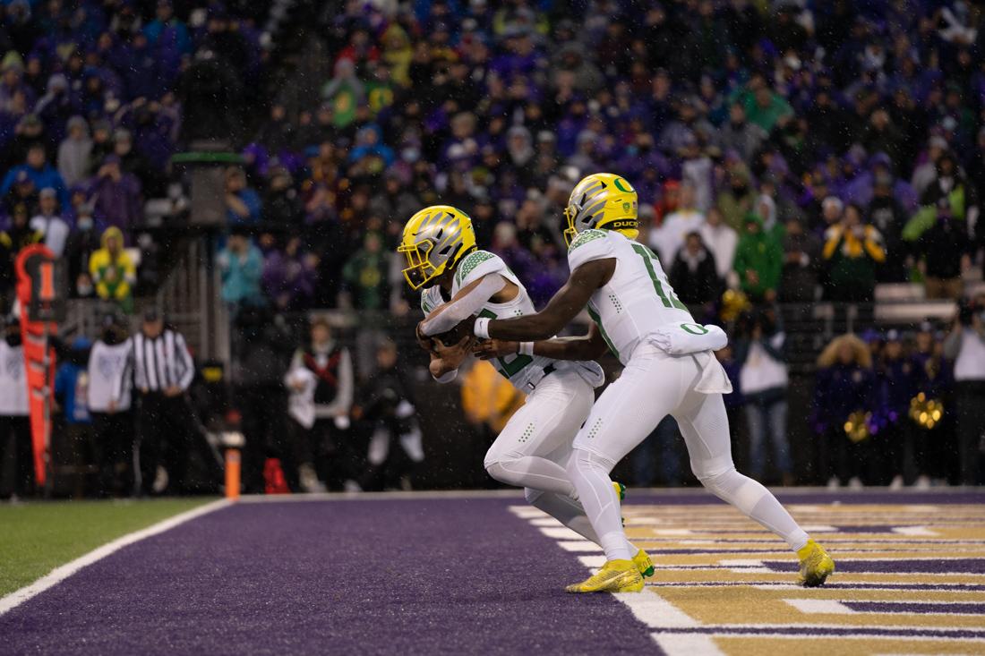 Travis Dye (26) goes to carry the ball out of the Oregon endzone to avoid the Ducks second safety of the night. The Oregon Ducks take on the Washington Huskies at Husky Stadium in Seattle, Wash., on November 6, 2021. (Serei Hendrie/Emerald)