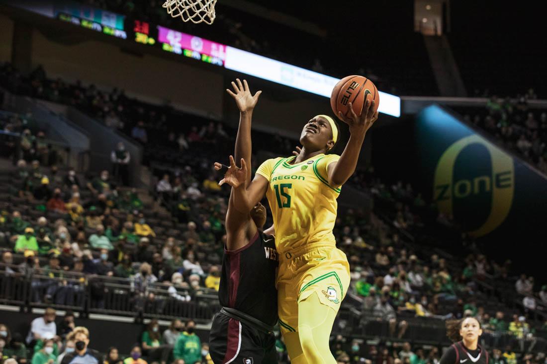 Ducks center Phillipina Kyei (15) jumps for a shot against Warrior defensive efforts.&#160;Oregon Ducks Women's Basketball faces Westmont College Warriors for an exhibition game on Nov. 6, 2021, at Matthew Knight Arena. (Maddie Stellingwerf/Emerald) (Maddie Stellingwerf/Emerald).