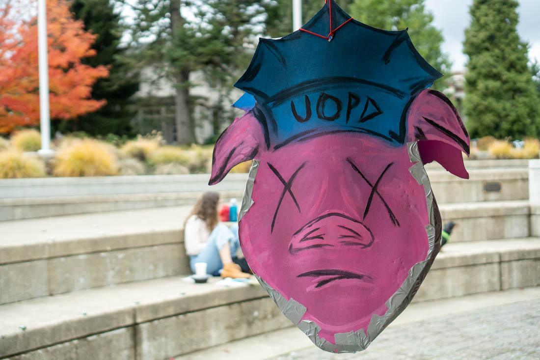 Several signs hang from the tents that house the Day of Demands in the Erb Memorial Fishbowl. The Day of Demands is a chance where students and faculy can present their collective demands from the University of Oregon. (Ali Watson/Emerald)