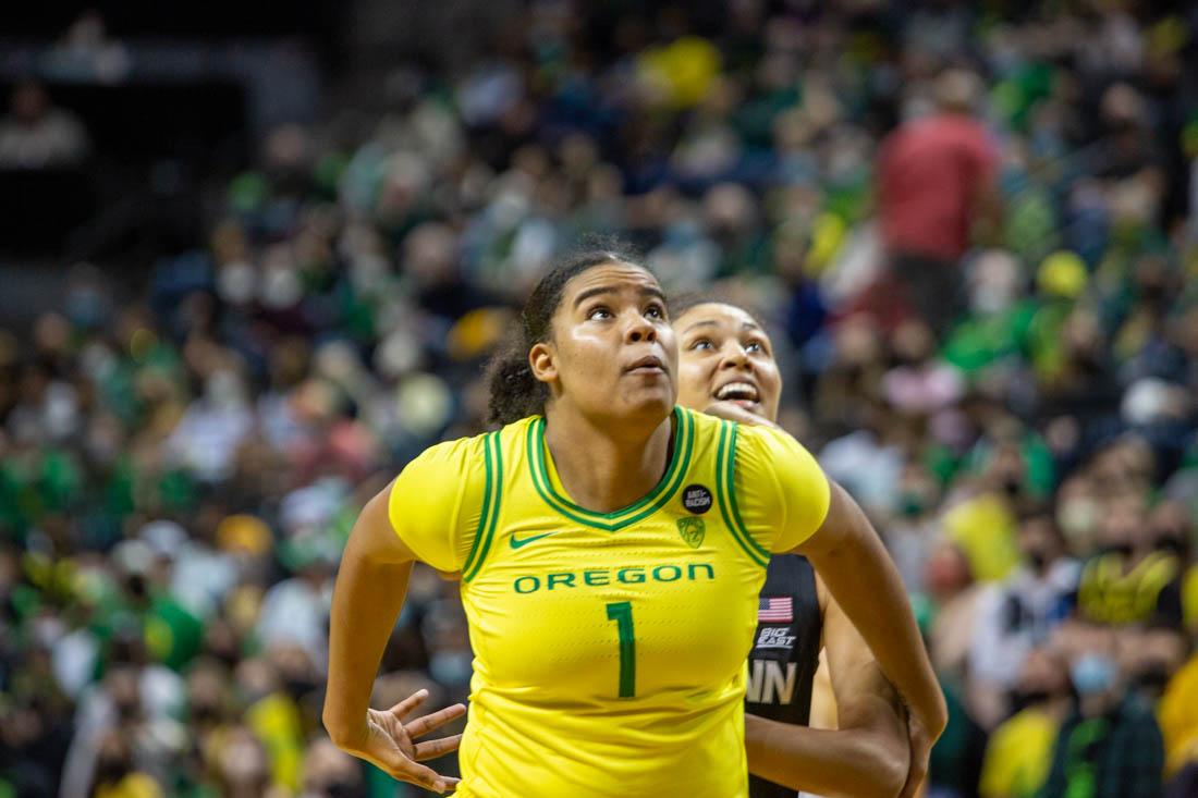 Nyara Sabal (1) blocks her oppsing teammate as UCONN Huskies score a point. Oregon Ducks take on the UCONN Huskies at Matthew Knight Arena in Eugene, Ore., on Jan. 17, 2022. (Ali Watson/Emerald)