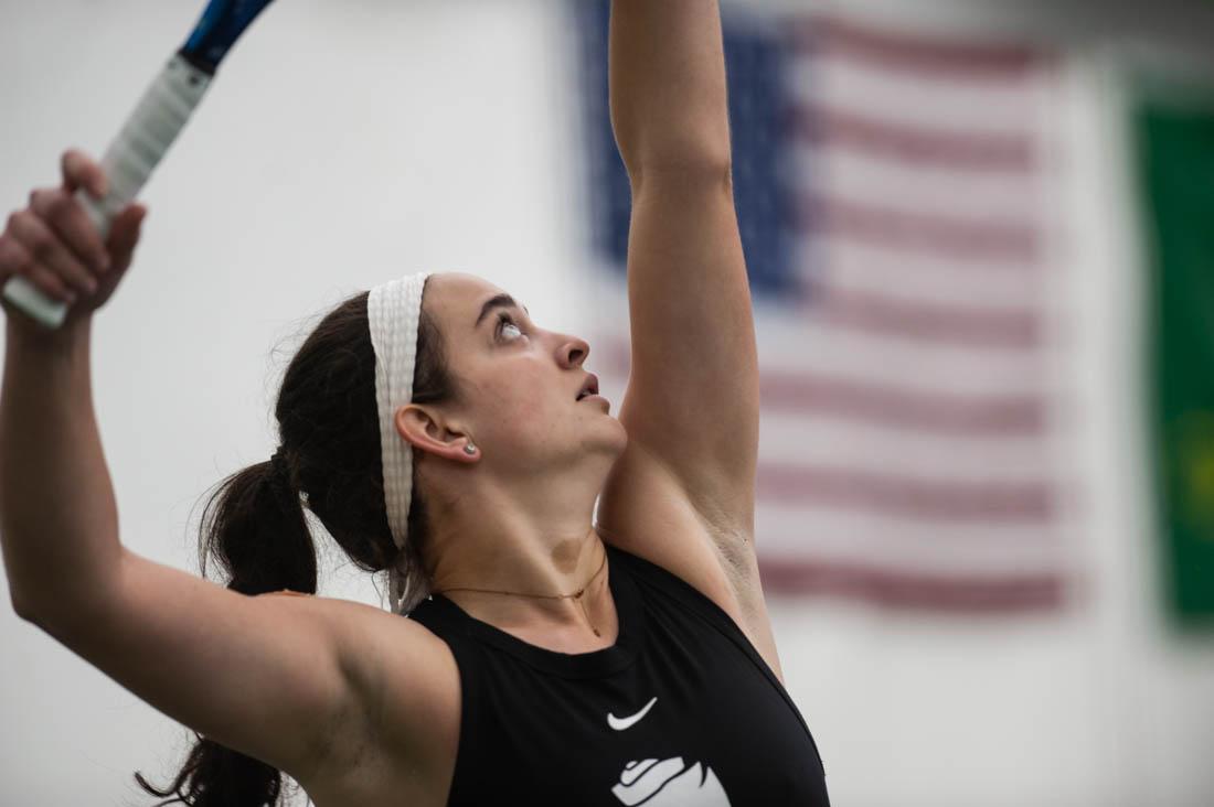 Duck junior Allison Mulville tosses up the ball before serving it across the court. UO Women&#8217;s Tennis takes on Portland State at the UO Student Tennis Center on Jan. 16th, 2022 (Mary Grosswendt/Emerald)