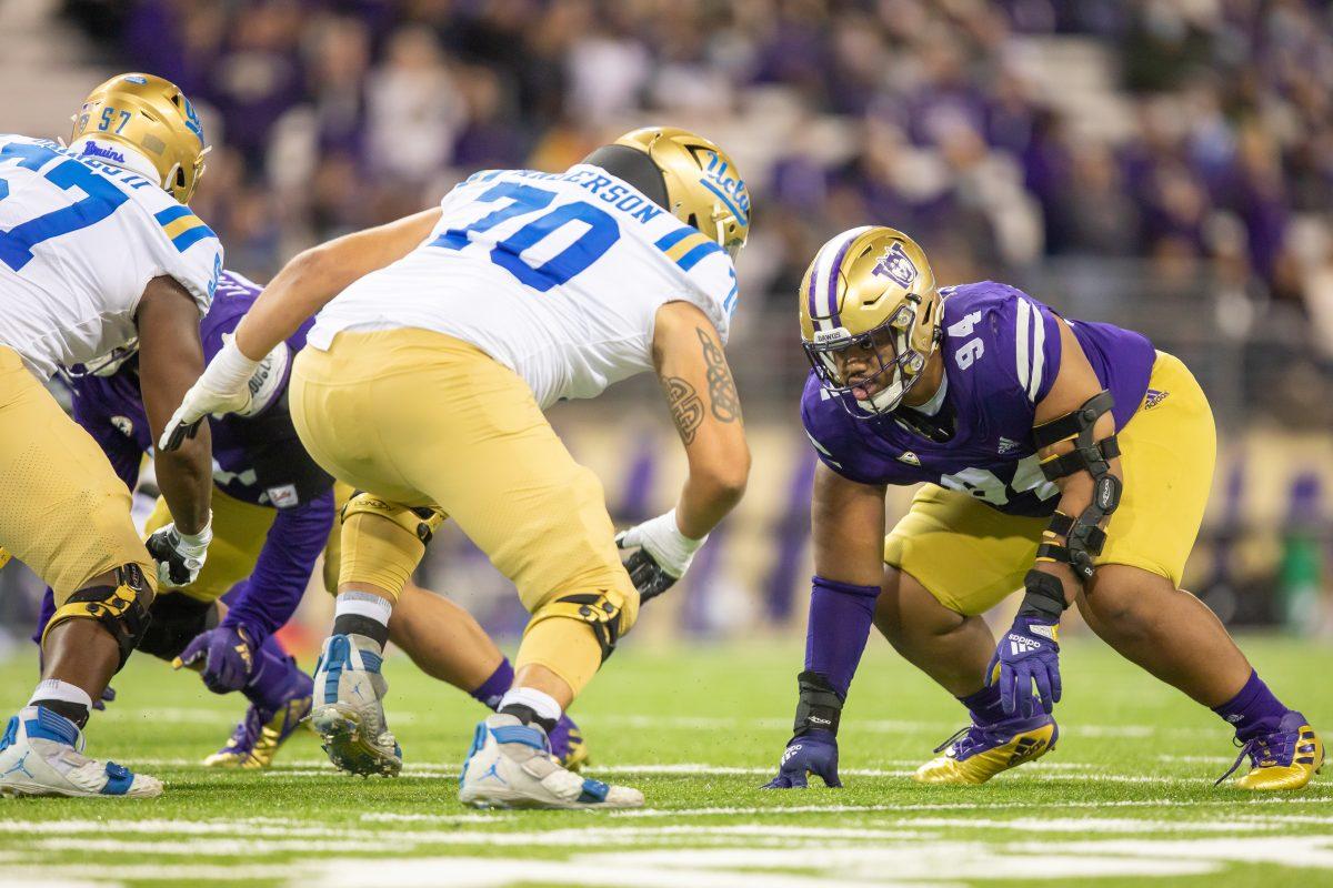 Sam Taimani takes his mark on the line during the Washington football game against UCLA on Oct.16 at Husky Football Stadium. (Emma Ottosen/The Daily UW)