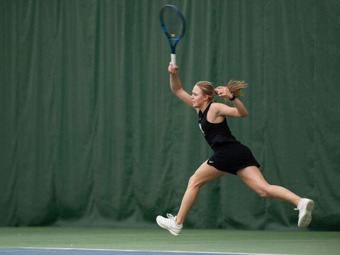 Duck freshman Sophie Luescher lunges across the court as she gets the ball over the net. UO Women&#8217;s Tennis takes on Portland State at the UO Student Tennis Center on Jan. 16th, 2022 (Mary Grosswendt/Emerald)