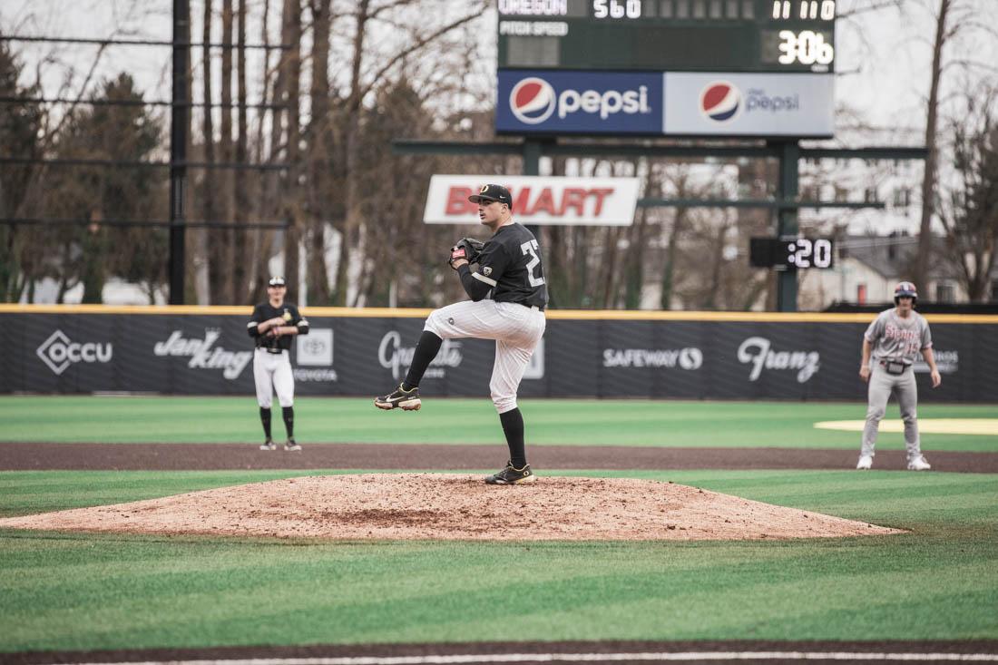 Ducks pitcher Andrew Mosiello (23) winds up for a pitch. Ducks Baseball take on St. Johns Red Storm at PK Field in Eugene, Or., on Feb. 26, 2022. (Maddie Stellingwerf/Emerald)