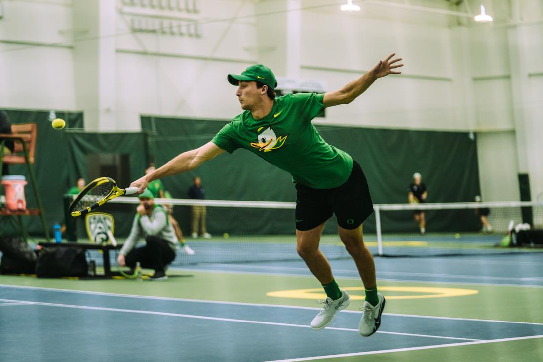 Luke Vandecasteele extends to keep the rally alive. The Oregon Ducks Mens&#8217;s Tennis team plays the Portland Pilots, on March 13th, 2022, at the University of Oregon. (Serei Hendrie/Emerald)