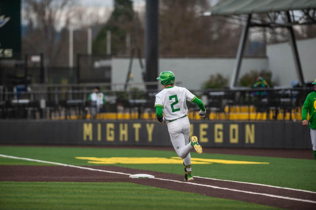 Jack Scanlon (2) rounds first base after a hit. Oregon Baseball takes on UC Santa Barbara Gauchos at PK Field in Eugene, Ore. on Mar. 4, 2022. (Mary Grosswendt/Emerald)