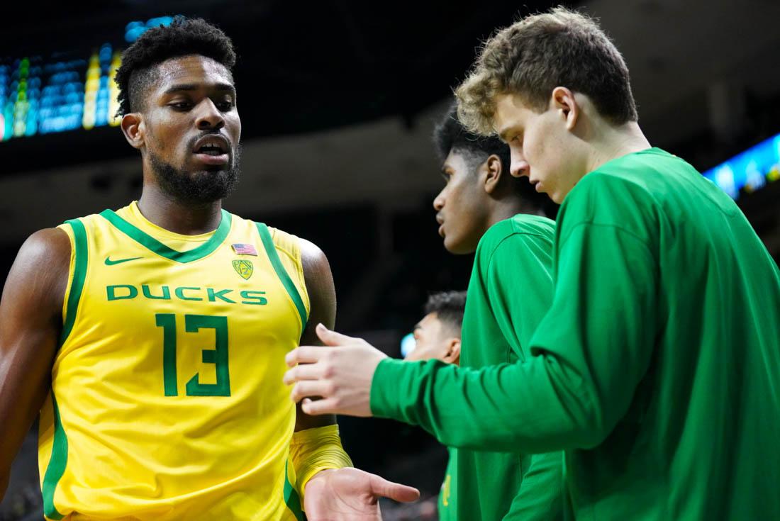 <p>Ducks forward Quincy Guerrier returns to the bench after being subbed out. Oregon basketball loses to the California Golden Bears at Matthew Knight Arena in Eugene, Ore. on Feb. 12, 2022. (Jackson Knox/Emerald)</p>