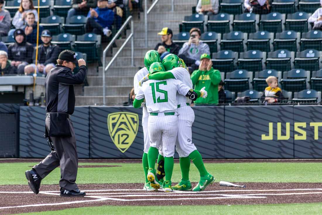 Oregon players celebrate following a homerun in the first inning. The Oregon Ducks Baseball team takes on UCSB on March 5th, 2022, at PK Park. (Molly McPherson/Emerald)