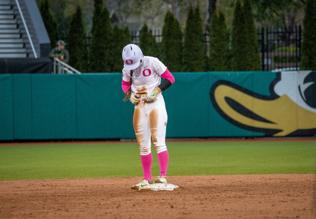 Ariel Carlson (3) fixes her uniform after successfully sliding into second base. The Oregon Ducks Softball Team takes on rival Oregon State on April 29th, 2022, at Janes Sanders Stadium. (Jonathan Suni, Emerald)