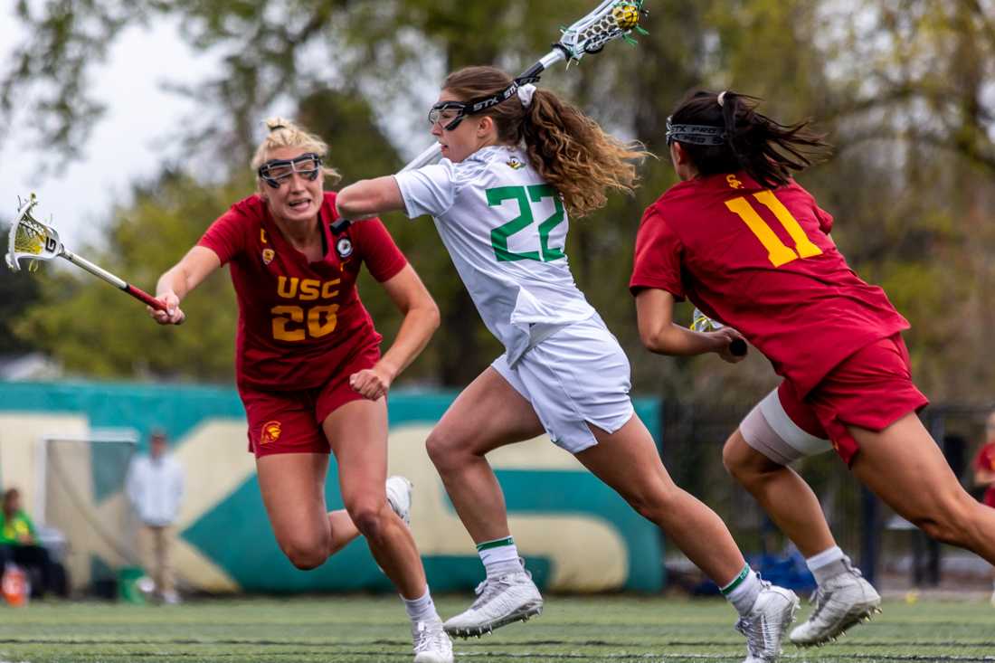 Shonly Wallace (22) launches off the 8-meter arc for a free position. The Oregon Lacrosse team takes on USC on April 17th, 2022, at Pap&#233; Field. (Molly McPherson/Emerald)