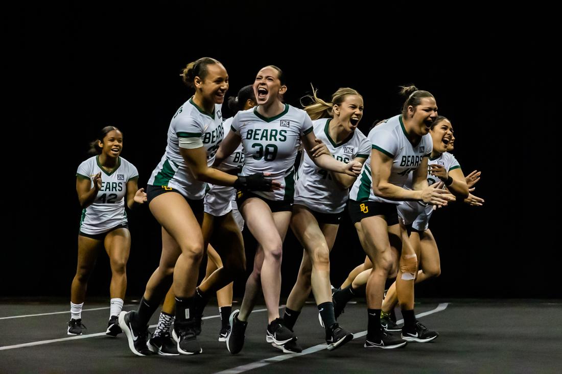 The Baylor Bears celebrate after performing an event. The Oregon Acrobatics and Tumbling team takes on Baylor on April 10th, 2022, at Matthew Knight Arena. (Molly McPherson/Emerald)