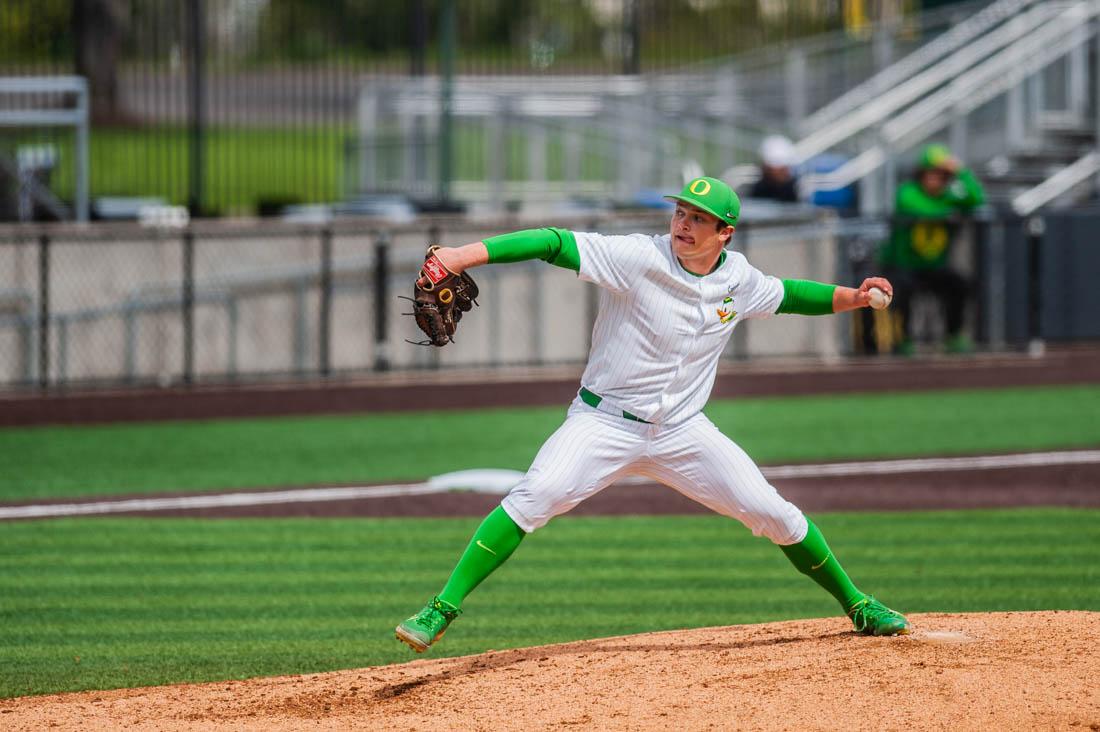 Pitcher Kolby Somers (24) lunges across the mound and throws a pitch. Oregon Baseball takes on Ball State on April 9th, 2022 in Eugene, Ore. (Mary Grosswendt/Emerald)