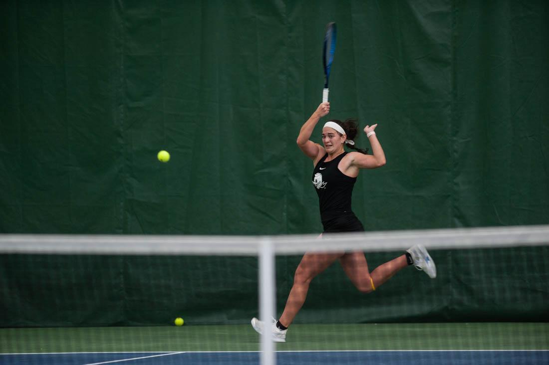 Duck junior Allison Mulville watches the ball after she slams it to her opponent. UO Women&#8217;s Tennis takes on Portland State at the UO Student Tennis Center on Jan. 16th, 2022 (Mary Grosswendt/Emerald)