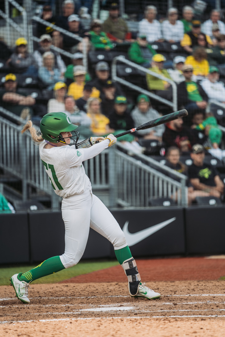 Allee bunker looks out in her follow through after sending the ball deep into the outfield. The Oregon Ducks Softball team faces the Oregon State Beavers, on May 1st, 2022, at Jane Sanders Stadium. (Serei Hendrie/Emerald)