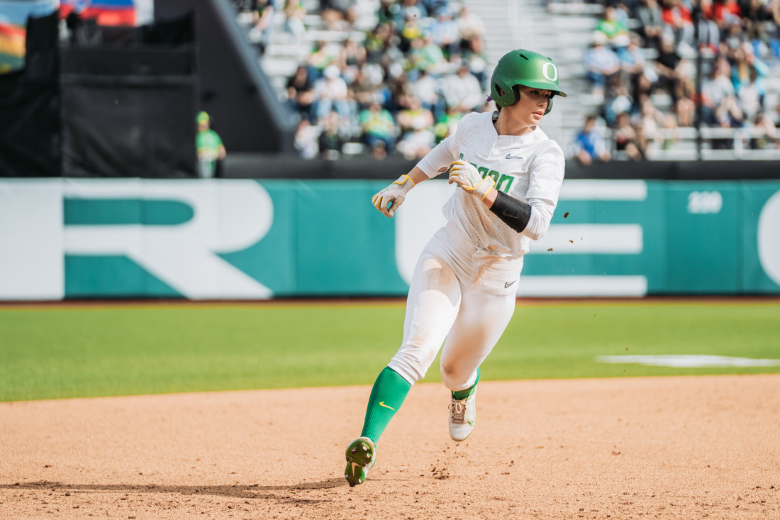 Ariel Carlson rounds third base running towards home plate after a double base hit. The Oregon Ducks Softball team faces the Oregon State Beavers, on May 1st, 2022, at Jane Sanders Stadium. (Serei Hendrie/Emerald)