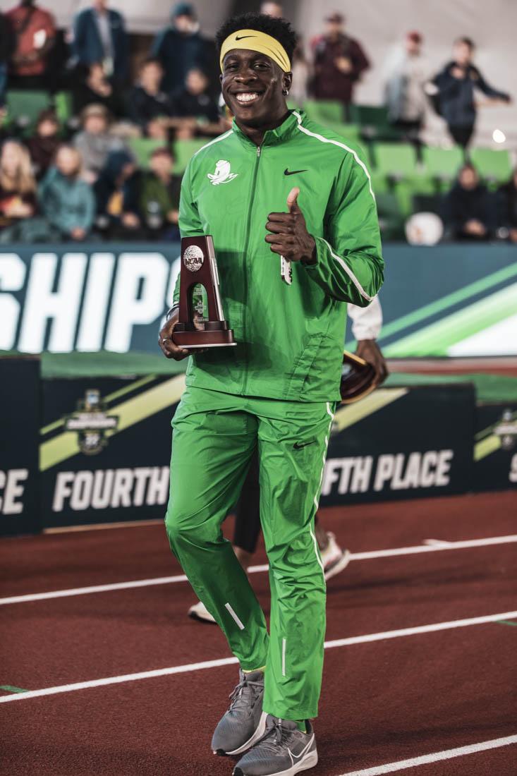 Ducks athlete Emmanuel Iheemje flashes a smile after placing second overall in the Mens triple jump. University of Florida Gators mens track team take home the national championship on the third day of the 2022 NCAA Track &amp; Field Championships at Hayward Field in Eugene, Ore., on June 10th, 2022. (Maddie Stellingwerf/Emerald)