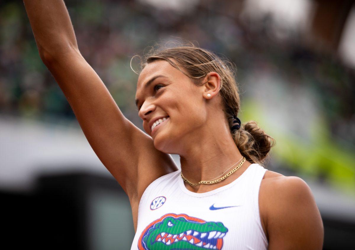 Anna Hall waves to the crowd while celebrating her national championship title.&#160;University of Florida Gators women's track team take home the national championship on the fourth day of the 2022 NCAA Track &amp; Field Championships at Hayward Field in Eugene, Ore., on June 11th, 2022. (Liam Sherry/Emerald)