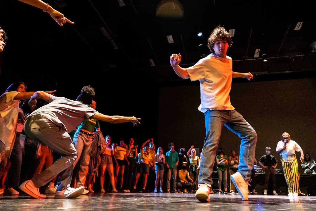 A performer makes their way to the middle of the circle. The Duck Jam, a celebration of hip-hop culture and dance, took place on June 1st, 2022, at the Dougherty Dance Theatre in Eugene, Ore. (Molly McPherson/Emerald)