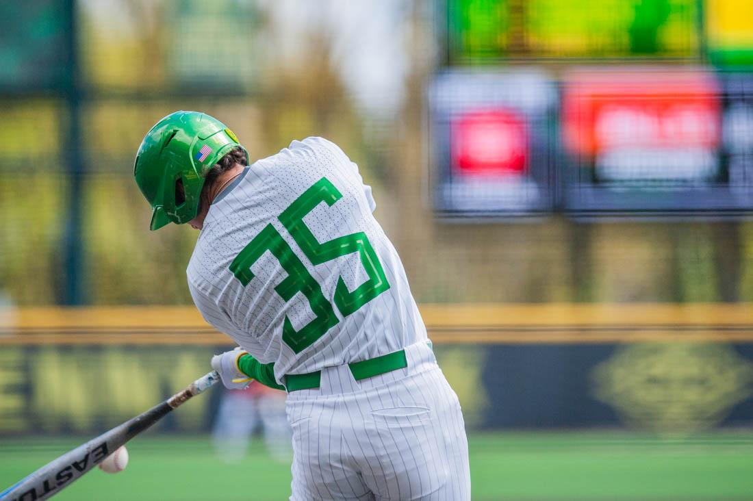 Anthony Hall (35) hits the ball while up at-bat. Oregon Baseball takes on Ball State on April 9th, 2022 in Eugene, Ore. (Mary Grosswendt/Emerald)