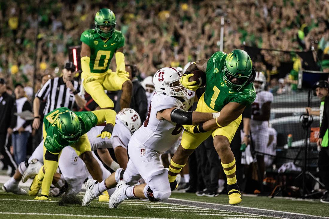 Duck sophomore inside linebacker Noah Sewell (1) recovers a fumble made by Cardinal offense, rushing the ball towards Ducks goal line. The University of Oregon Ducks take on the Stanford Cardinal on Oct. 1, 2022 at Autzen Stadium in Eugene, Ore.(Maddie Stellingwerf/Emerald)