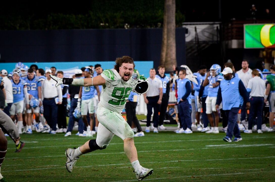 Oregon defensive lineman, Casey Rogers (98) celebrates after winning the Holiday Bowl. The Oregon Ducks face the North Carolina Tar Heels in the annual Holiday Bowl at Petco Park in San Diego, CA, on December 28th, 2022. (Kai Kanzer/Emerald)