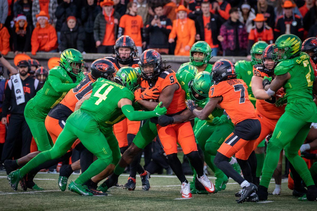 Bennet Williams (4), along with other Ducks, stop a Beaver running back.&#160;The Oregon Ducks travel up to Corvallis to face their in-state rival the Oregon State Beavers on November 26th, 2022, for their last game of the regular season.&#160;(Jonathan Suni, Emerald)