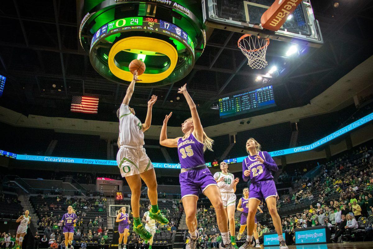 Endyia Rogers (4) shoots a floater over her defender.&#160;The Oregon Ducks host Carroll College for an exhibition match on October28th, 2022, at Matthew Night Arena. (Jonathan Suni, Emerald)