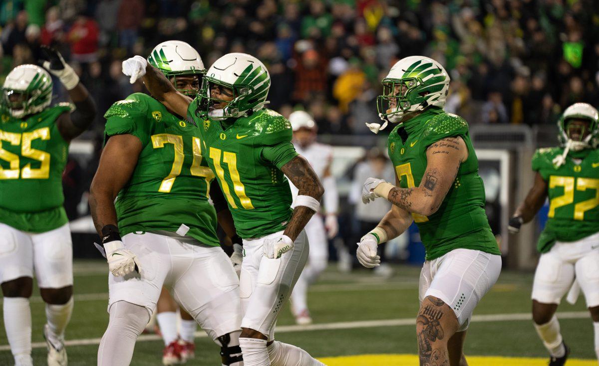 Troy Franklin emphatically celebrates a touchdown. Oregon beats no.10 Utah on November 19th, 2022, at Autzen Stadium. (Liam Sherry, Emerald)