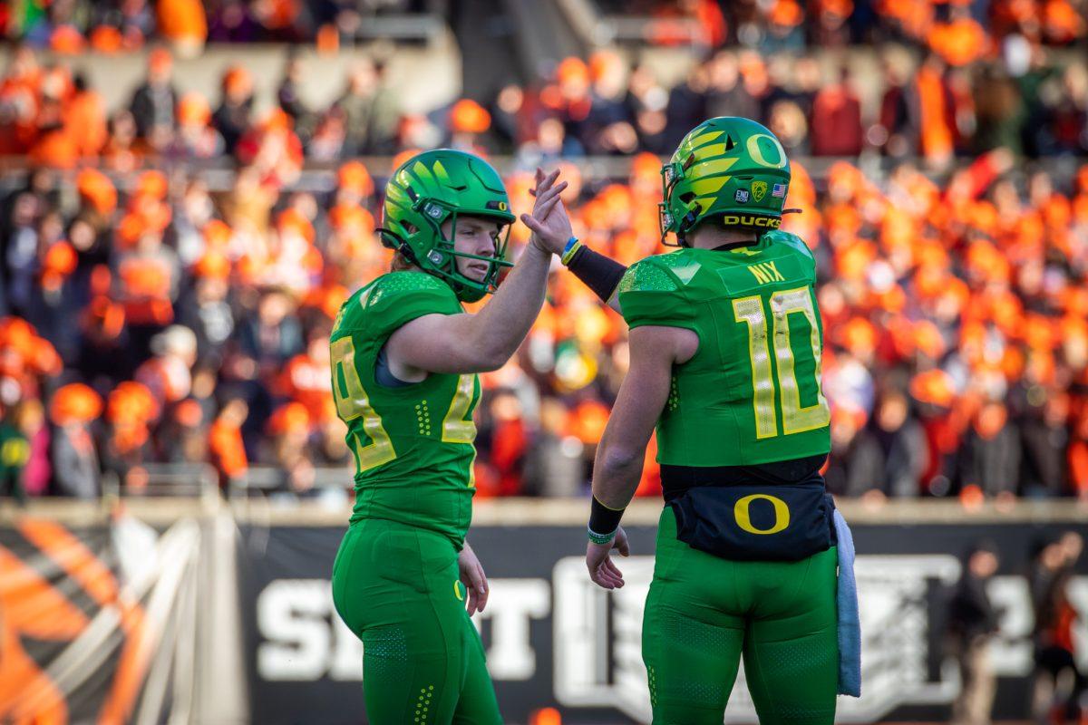 Bo Nix (10) goes to high five Camden Lewis (49) after drilling the extra point.&#160;The Oregon Ducks travel up to Corvallis to face their in-state rival the Oregon State Beavers on November 26th, 2022, for their last game of the regular season.&#160;(Jonathan Suni, Emerald)