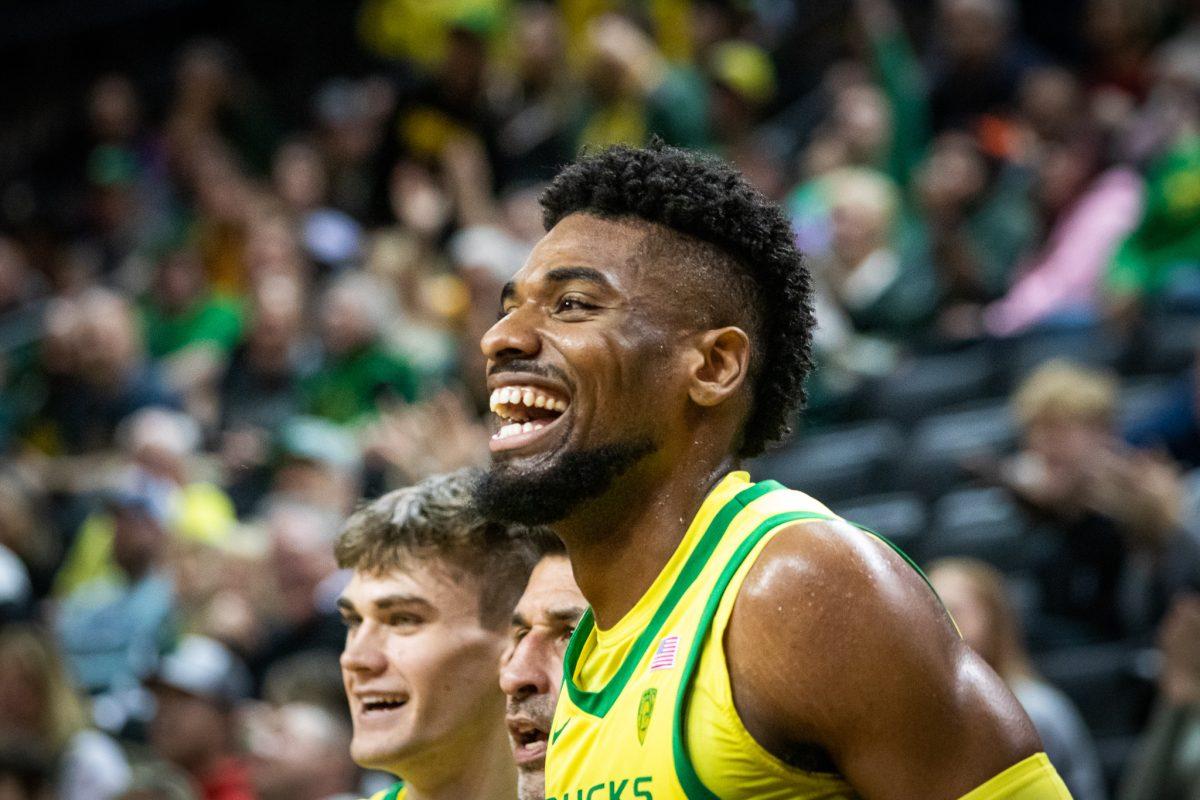 Quincey Guerrier laughs as his team begins to celebrate the big win over Arizona.&#160;The Oregon Ducks host the #6 ranked Arizona Wildcats&#160;at Matthew Knight Arena in Eugene, Ore., on Jan. 14, 2023. (Jonathan Suni, Emerald)