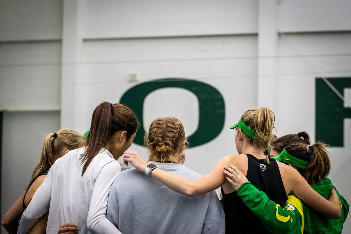 The team huddles up after the conclusion of all the doubles matches to prepare for the singles matches to begin.&#160;The Oregon Women's Tennis team hosts Portland State at the Student Tennis Center in Eugene, Ore., on January 20th. (Jonathan Suni, Emerald)