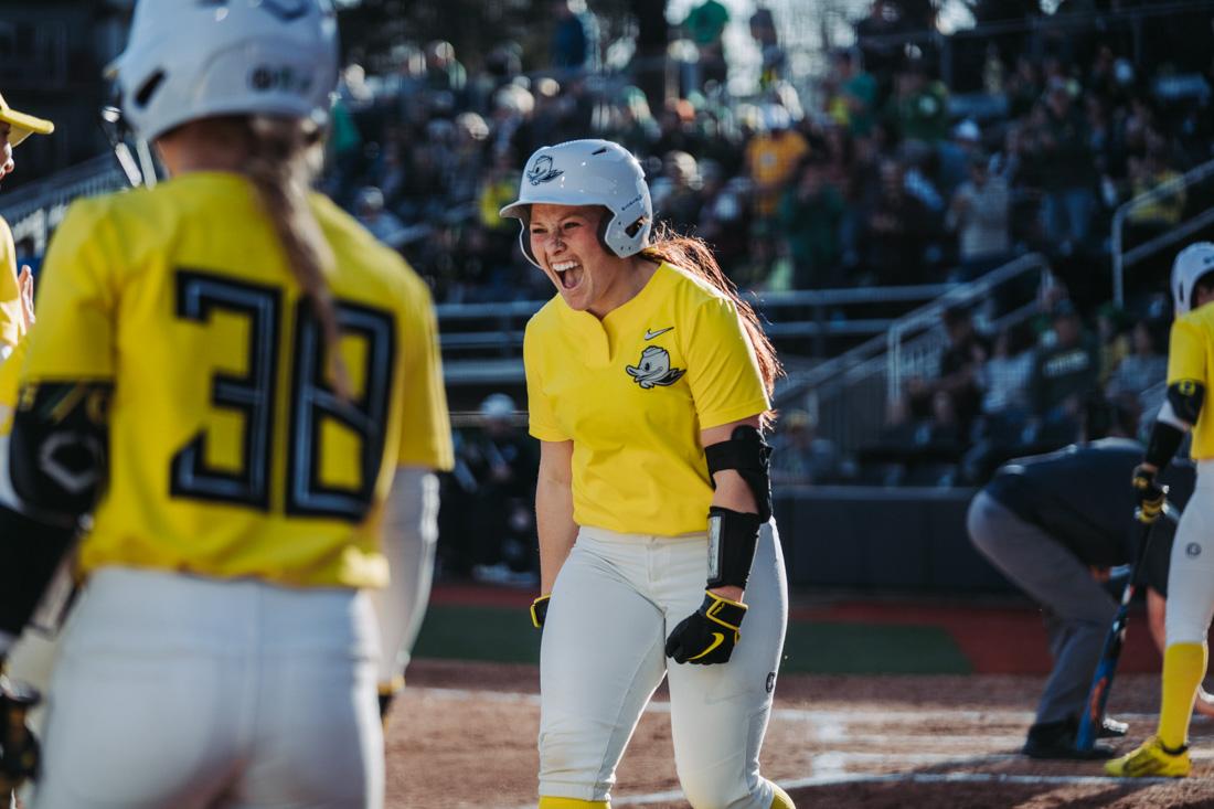 Vallery Wong runs to celebrate with her team after hitting the first home run of the game. The Oregon Ducks Softball team faces the Portland State Vikings, on March 11th, 2022, at Jane Sanders Stadium. (Serei Hendrie/Emerald)