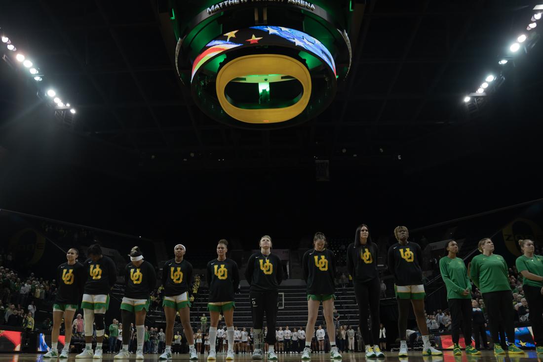 Prior to tip-off the team lines up for the playing of the National Anthem but the UO band. University of Oregon Women's Basketball hosts Rice University in the WNIT Second Round. (Skyler Davis/ Emerald)