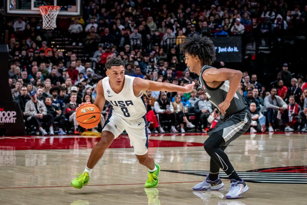 University of Oregon commit, Jackson Shelstad (8), pushes off Canadian representative, Aden Holloway (1).&#160;The top high school athletes in the world represent their respective countries at the Nike Hoop Summit held at the Moda Center in Portland, Ore., on April 8th, 2023. (Jonathan Suni, Emerald).