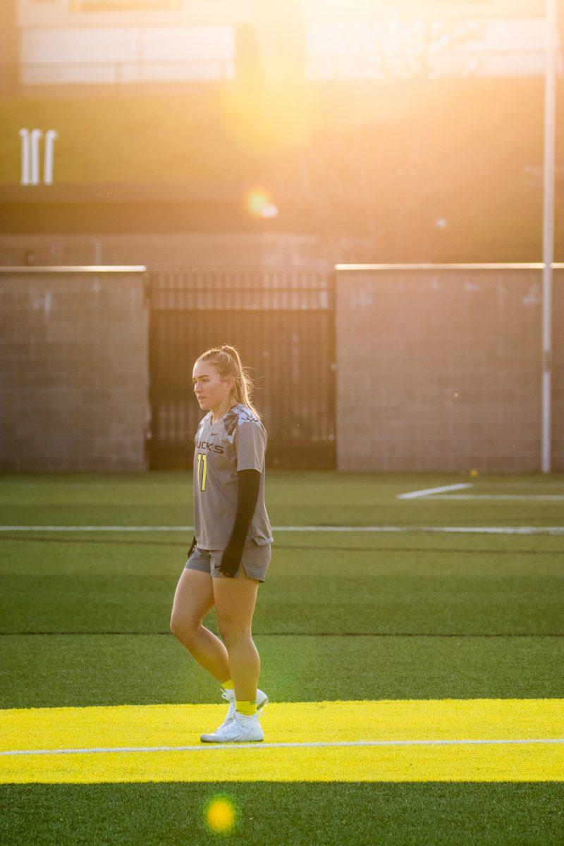 Mara Zajac (11) soaks in the Oregon sunset after the game's conclusion.&#160;The Oregon Ducks Lacrosse team take on the Arizona State&#160;Sound Devils at Pap&#233; Field in Eugene, Ore., on April 14th, 2023. (Jonathan Suni, Emerald)