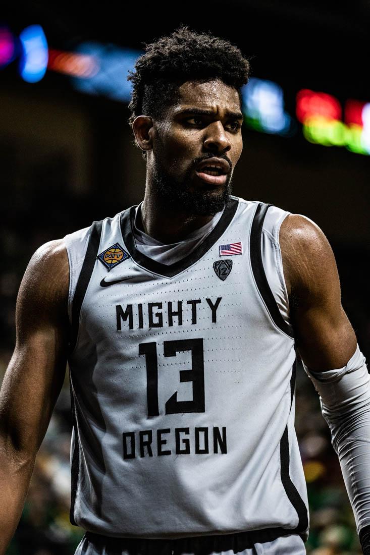 Ducks forward Quincy Guerrier (13) walks over to the sideline to throw in a ball. University of Oregon Mens Basketball take on the Wisconsin Badgers in round 3 of the National Invitational Tournament at Matthew Knight Arena in Eugene, Ore., on Mar. 21, 2023. (Maddie Stellingwerf/Emerald).