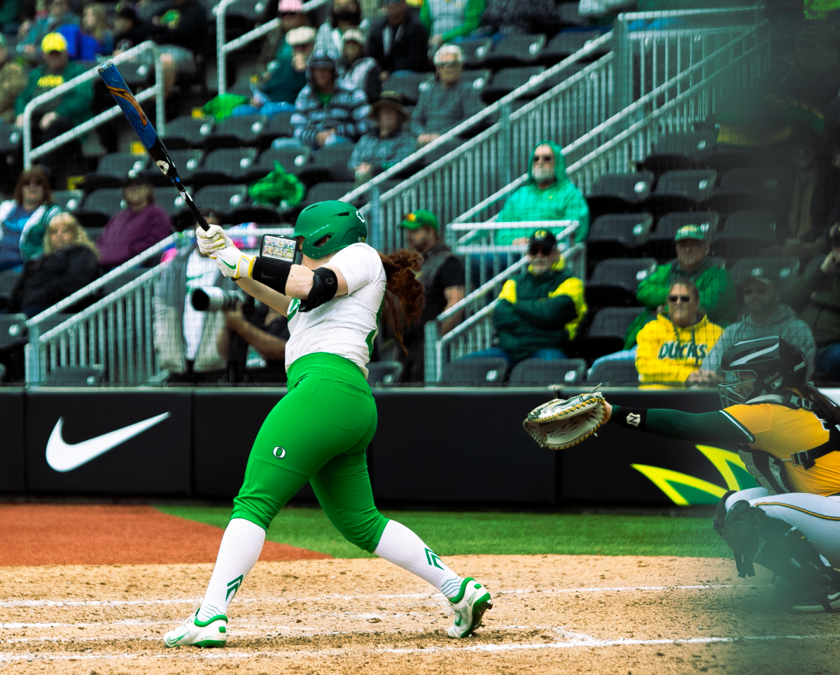 Vallery Wong hits an RBI single during the bottom of the 6th. The Oregon Ducks softball team faces off against NDSU, Saturday, March 12, 2022. (Liam Sherry/Emerald)