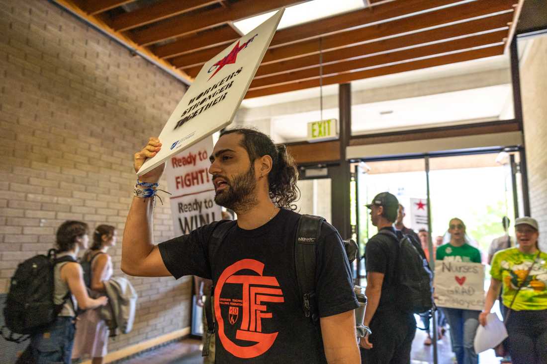 Rally attendees enter McKenzie Hall to begin their bargaining session. Members of Oregon&#8217;s Graduate Workers Union rallied with community members outside of McKenzie Hall ahead of their next bargaining session on June 2, 2023. (Molly McPherson/Emerald)