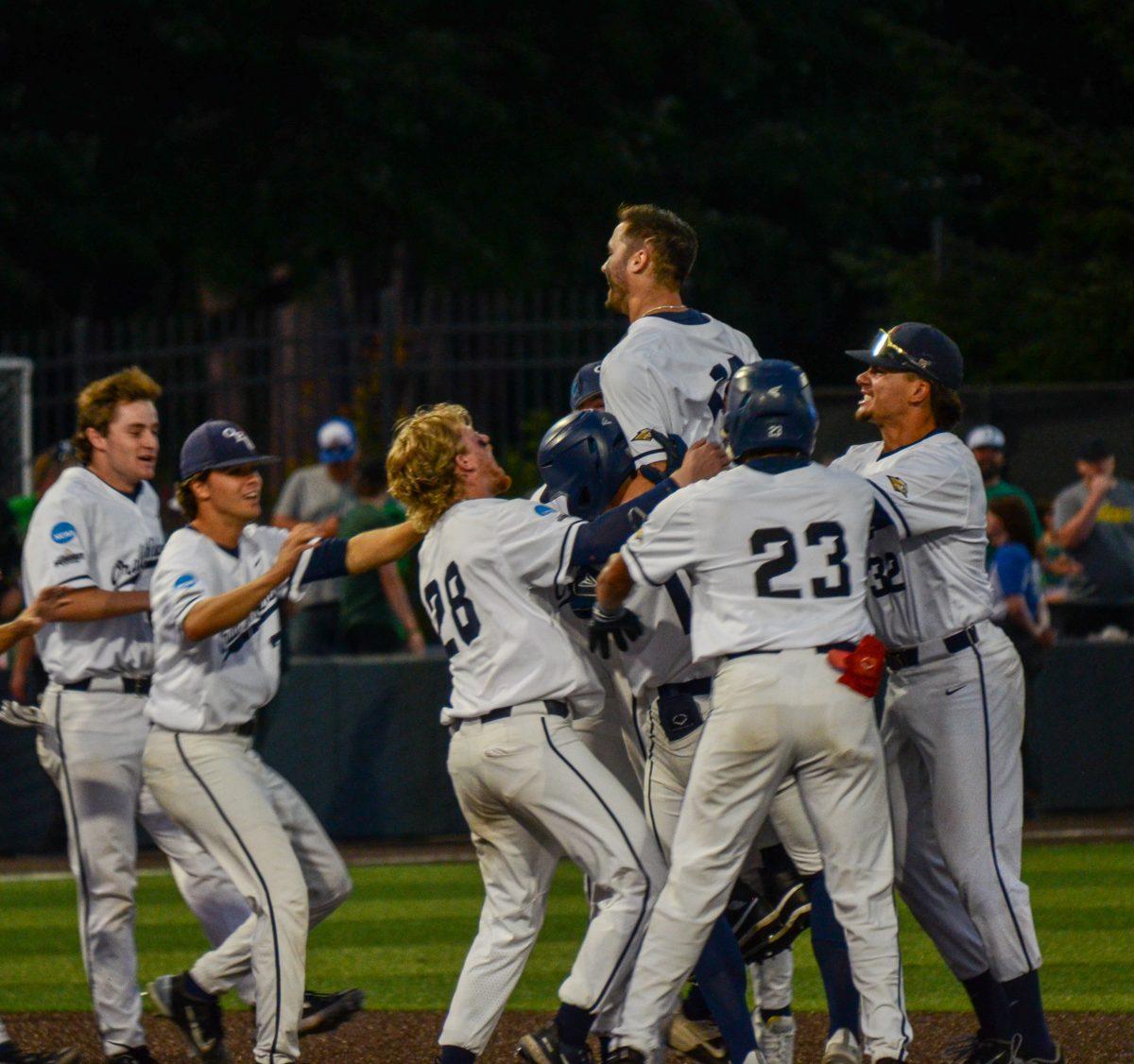 Justin Quinn (13) hits a walkoff 2 RBI single. Oral Roberts defeats the Oregon Baseball team in game 2 of Super Regionals on June 10th at PK Park. (Kai Kanzer/Emerald)