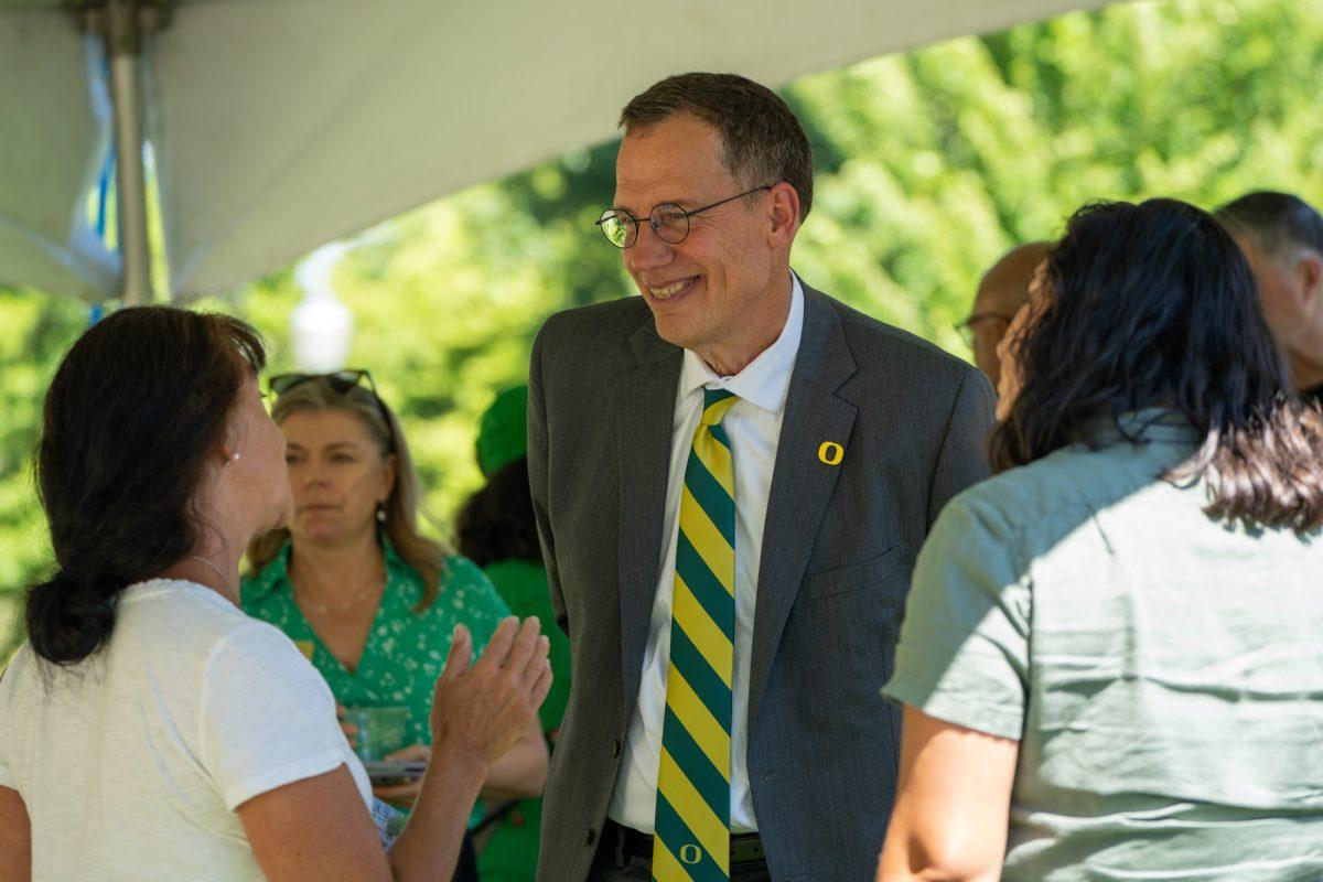 President Scholz talks with attendees at the summer ice cream social. The University of Oregon hosted a meet-and-greet with President John Karl Scholz on July 12, 2023. (Nicholas Walcott/University Communications)